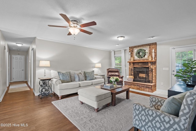 114 Mohican Trl, Wilmington, NC 28409 - living room with wood finished floors, a ceiling fan, healthy amount of natural light, baseboards, and ornamental molding
