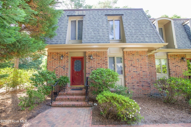 190 Palmetto Rd Unit 20, Pinehurst, NC 28374 - view of front facade featuring mansard roof, roof with shingles, and brick siding
