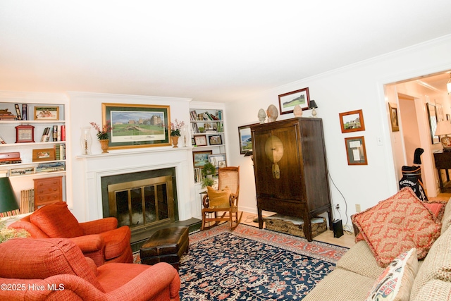 190 Palmetto Rd Unit 20, Pinehurst, NC 28374 - living room with a glass covered fireplace, crown molding, and built in shelves
