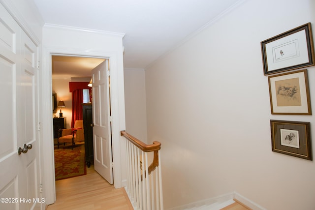 190 Palmetto Rd Unit 20, Pinehurst, NC 28374 - corridor featuring an upstairs landing, light wood-type flooring, and crown molding