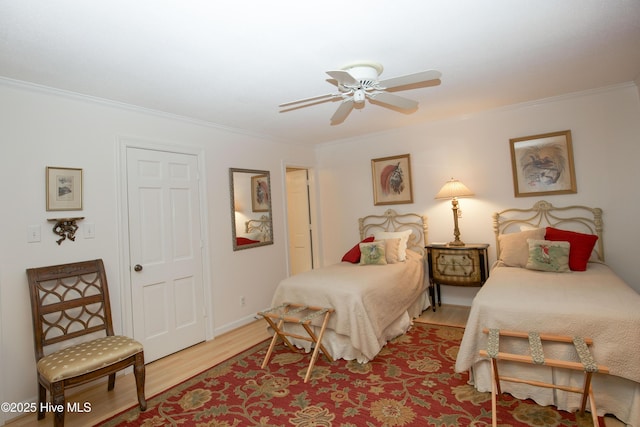 190 Palmetto Rd Unit 20, Pinehurst, NC 28374 - bedroom featuring ornamental molding, light wood-style flooring, ceiling fan, and baseboards