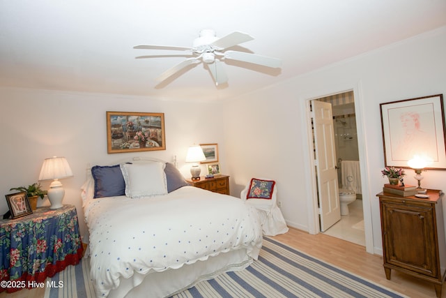 190 Palmetto Rd Unit 20, Pinehurst, NC 28374 - bedroom featuring light wood-type flooring, crown molding, connected bathroom, baseboards, and ceiling fan