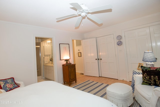 190 Palmetto Rd Unit 20, Pinehurst, NC 28374 - bedroom with light wood finished floors, ornamental molding, ensuite bathroom, and ceiling fan