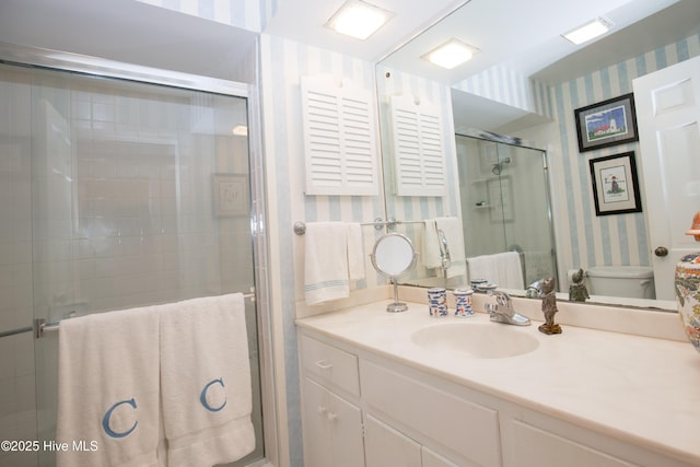 190 Palmetto Rd Unit 20, Pinehurst, NC 28374 - bathroom featuring wallpapered walls, vanity, toilet, and a shower stall