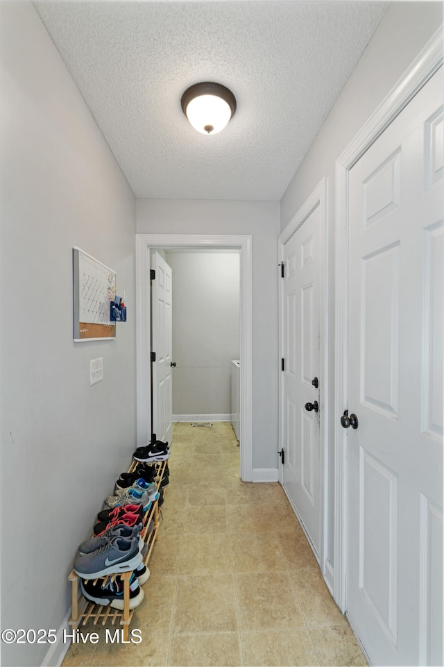202 Brookside Way, Pikeville, NC 27863 - corridor featuring a textured ceiling and baseboards