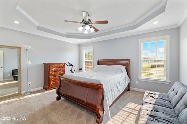 202 Brookside Way, Pikeville, NC 27863 - bedroom featuring a raised ceiling, ornamental molding, a textured ceiling, light colored carpet, and a ceiling fan