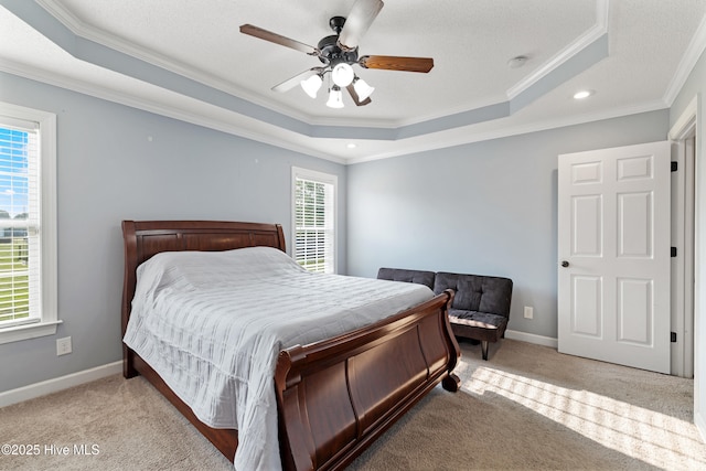 202 Brookside Way, Pikeville, NC 27863 - bedroom featuring a tray ceiling, crown molding, carpet floors, ceiling fan, and baseboards