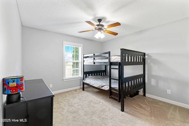 202 Brookside Way, Pikeville, NC 27863 - bedroom with carpet, baseboards, a textured ceiling, and a ceiling fan