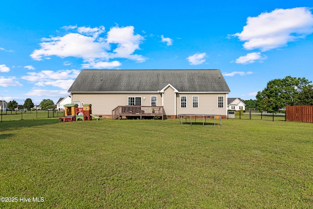 202 Brookside Way, Pikeville, NC 27863 - rear view of house featuring a trampoline, a playground, crawl space, and a wooden deck