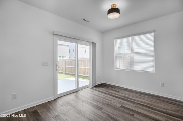 1617 Stanley St, Wilmington, NC 28401 - empty room featuring dark wood-type flooring and baseboards