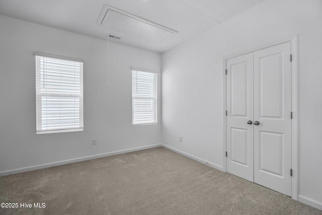 1617 Stanley St, Wilmington, NC 28401 - unfurnished bedroom with attic access, carpet floors, and baseboards