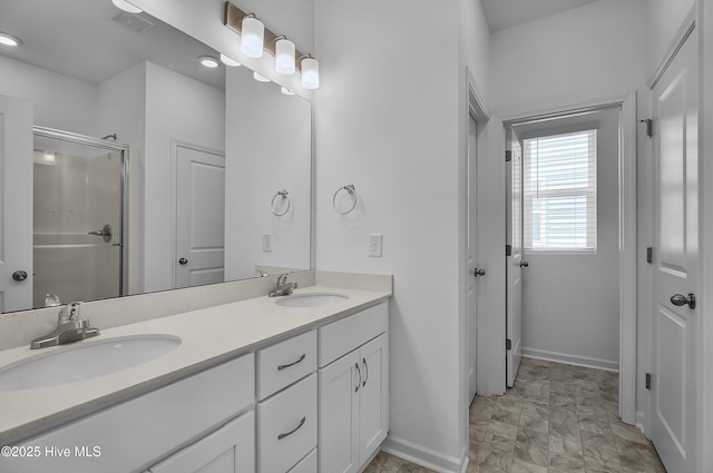 1617 Stanley St, Wilmington, NC 28401 - full bath with double vanity, baseboards, and a stall shower