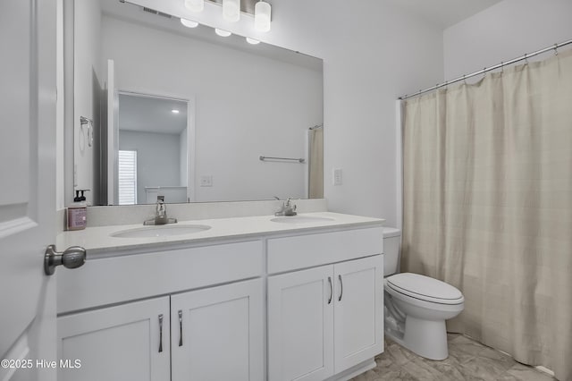 1617 Stanley St, Wilmington, NC 28401 - bathroom featuring double vanity, toilet, marble look tile flooring, and a shower with shower curtain