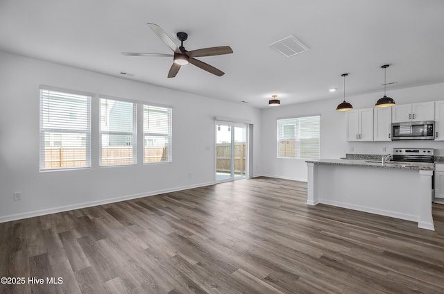 1617 Stanley St, Wilmington, NC 28401 - unfurnished living room featuring dark wood-style floors, ceiling fan, baseboards, and a sink