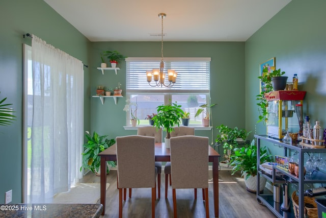 402 Saxby Way, Holly Ridge, NC 28445 - dining room featuring a chandelier and wood finished floors