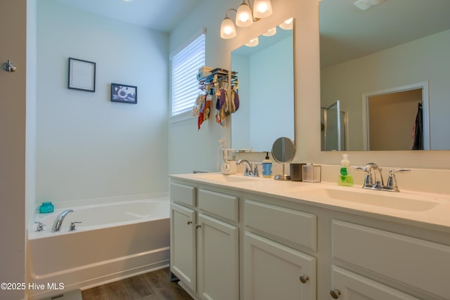402 Saxby Way, Holly Ridge, NC 28445 - full bathroom with double vanity, a bath, wood finished floors, and a shower with door