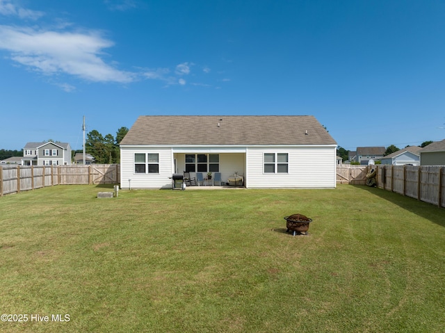 402 Saxby Way, Holly Ridge, NC 28445 - back of house with a fire pit, a patio area, and roof with shingles