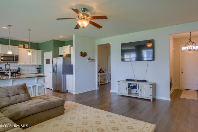 402 Saxby Way, Holly Ridge, NC 28445 - living area with dark wood-style flooring, a ceiling fan, baseboards, and recessed lighting