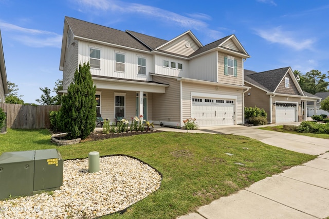 97 Violetear Rdg, Hampstead, NC 28443 - craftsman-style house featuring concrete driveway, board and batten siding, an attached garage, and covered porch