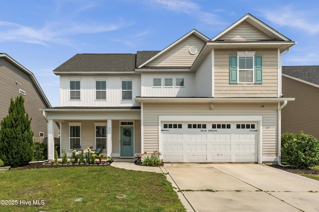 97 Violetear Rdg, Hampstead, NC 28443 - view of front of property featuring concrete driveway, covered porch, a front lawn, a garage, and a shingled roof