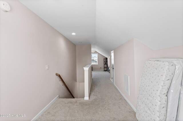 97 Violetear Rdg, Hampstead, NC 28443 - hallway featuring an upstairs landing, carpet floors, lofted ceiling, baseboards, and recessed lighting
