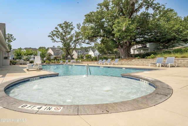 97 Violetear Rdg, Hampstead, NC 28443 - community pool featuring a patio and a residential view