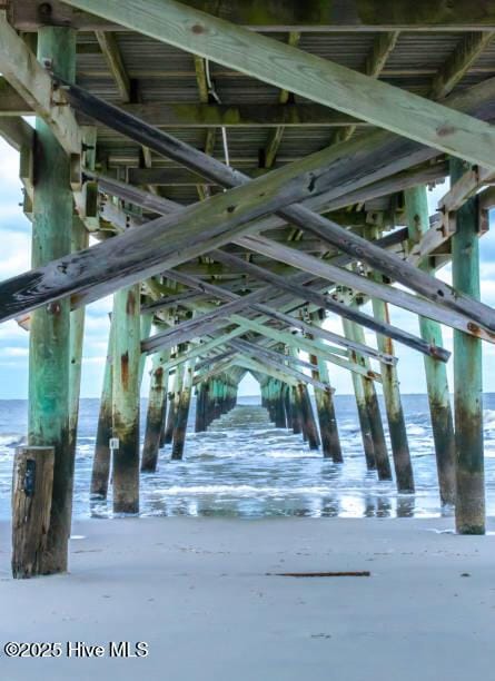 4920 E Beach Dr, Oak Island, NC 28465 - view of home's community featuring a water view and a pier