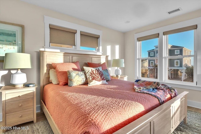 4920 E Beach Dr, Oak Island, NC 28465 - bedroom with baseboards and wood finished floors