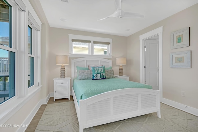 4920 E Beach Dr, Oak Island, NC 28465 - bedroom with baseboards and a ceiling fan