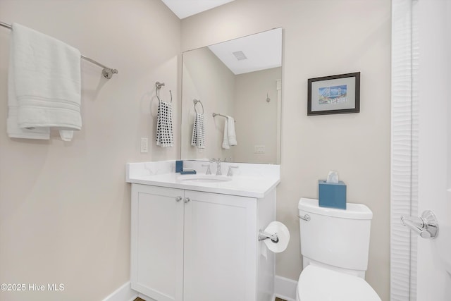 4920 E Beach Dr, Oak Island, NC 28465 - bathroom with vanity, toilet, and baseboards