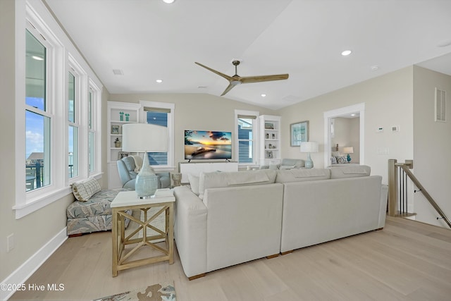 4920 E Beach Dr, Oak Island, NC 28465 - living area with light wood-type flooring, a ceiling fan, lofted ceiling, baseboards, and recessed lighting