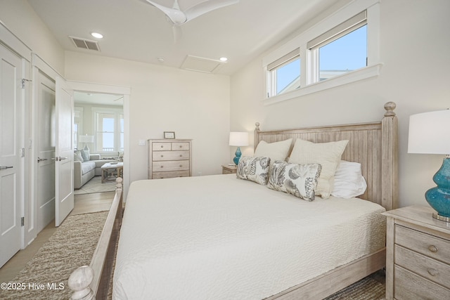 4920 E Beach Dr, Oak Island, NC 28465 - bedroom featuring multiple windows, attic access, and recessed lighting