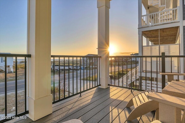 4920 E Beach Dr, Oak Island, NC 28465 - balcony at dusk featuring a water view