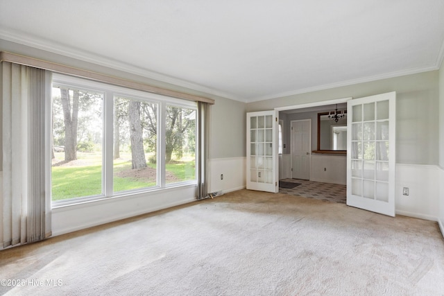 280 Cornwallis Rd, Teachey, NC 28464 - empty room featuring french doors, carpet flooring, ornamental molding, and a chandelier
