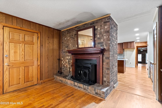 280 Cornwallis Rd, Teachey, NC 28464 - unfurnished living room with wood walls and light wood-style floors