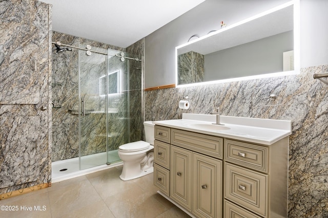 280 Cornwallis Rd, Teachey, NC 28464 - bathroom with tile walls, a shower stall, vanity, and tile patterned floors