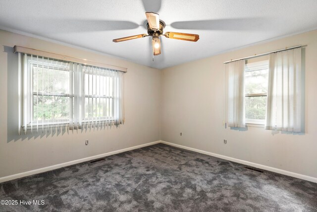 280 Cornwallis Rd, Teachey, NC 28464 - carpeted empty room with baseboards and a ceiling fan