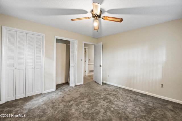 280 Cornwallis Rd, Teachey, NC 28464 - unfurnished bedroom with carpet, two closets, and a ceiling fan
