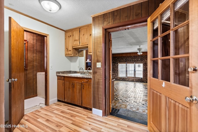280 Cornwallis Rd, Teachey, NC 28464 - kitchen with crown molding, a ceiling fan, light wood finished floors, and a textured ceiling