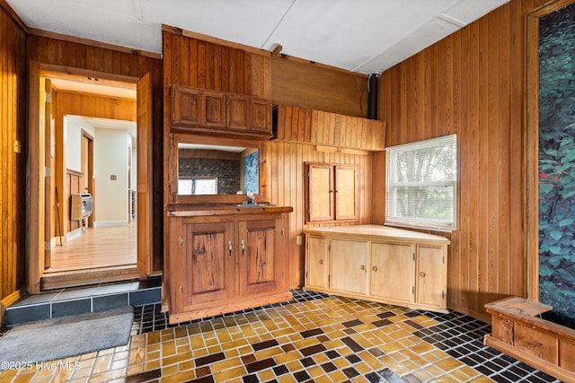 280 Cornwallis Rd, Teachey, NC 28464 - kitchen with wooden walls and brown cabinets