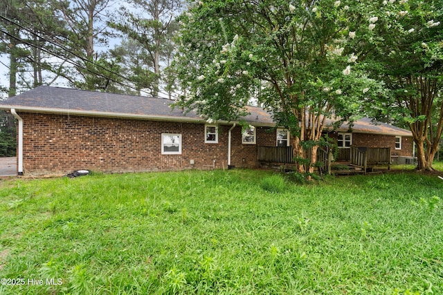 280 Cornwallis Rd, Teachey, NC 28464 - rear view of house featuring brick siding, a lawn, and a deck