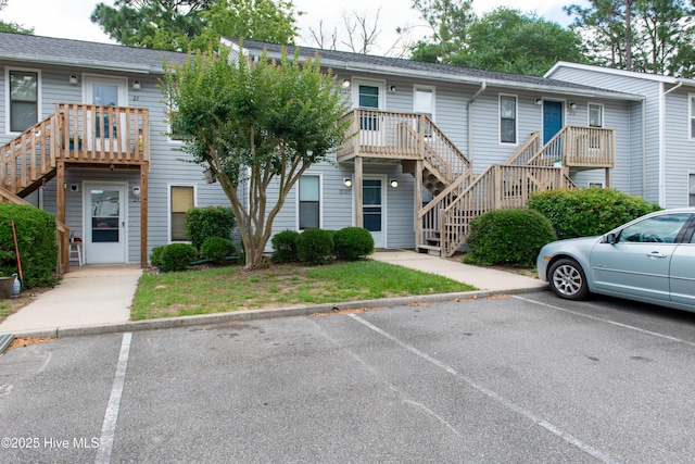 2525 Flint Dr, Wilmington, NC 28401 - view of property with stairs and uncovered parking