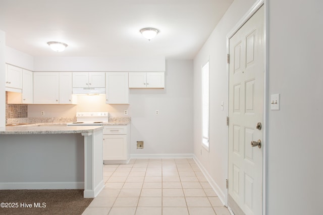2525 Flint Dr, Wilmington, NC 28401 - kitchen with electric stove, under cabinet range hood, healthy amount of natural light, and white cabinets