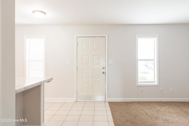 2525 Flint Dr, Wilmington, NC 28401 - foyer with baseboards and light tile patterned floors
