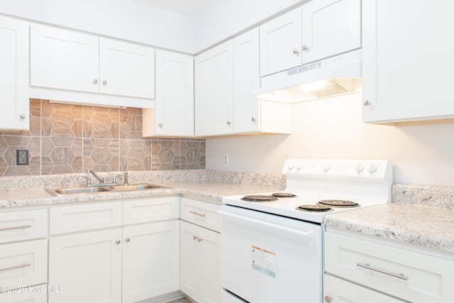2525 Flint Dr, Wilmington, NC 28401 - kitchen featuring white electric stove, under cabinet range hood, a sink, white cabinetry, and decorative backsplash
