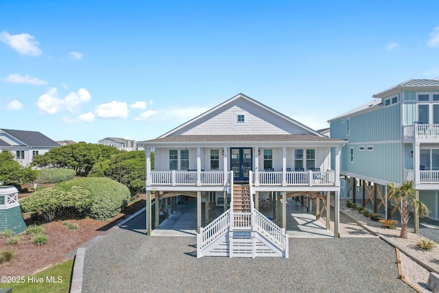 1044 Ocean Blvd W, Supply, NC 28462 - view of front of house with a carport, gravel driveway, and a porch