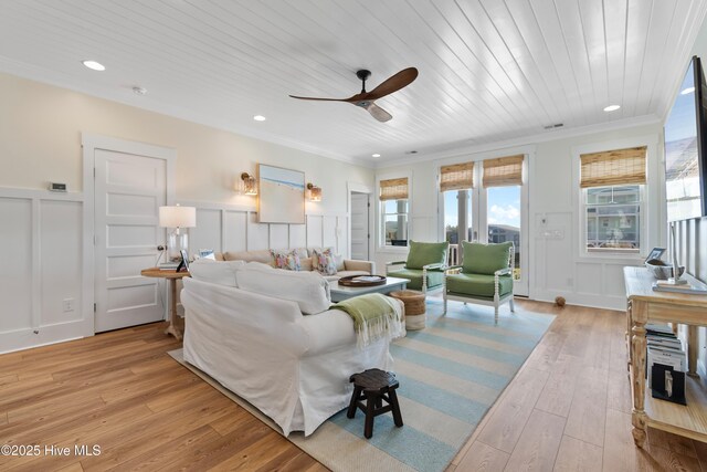 1044 Ocean Blvd W, Supply, NC 28462 - living room featuring a decorative wall, a ceiling fan, light wood-style flooring, crown molding, and recessed lighting
