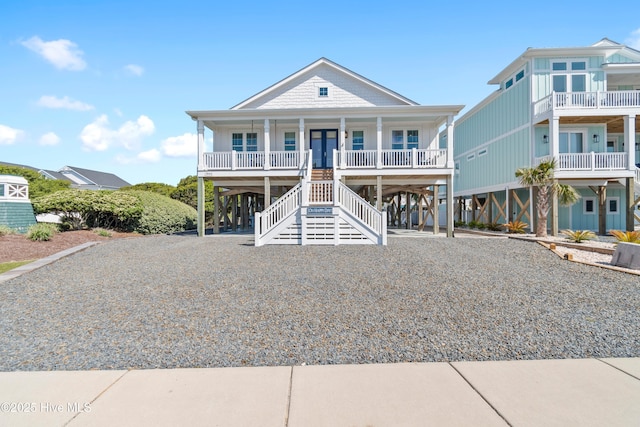 1044 Ocean Blvd W, Supply, NC 28462 - beach home featuring a carport, a porch, stairs, and driveway