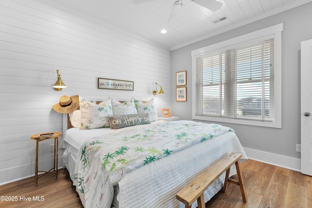 1044 Ocean Blvd W, Supply, NC 28462 - bedroom featuring baseboards, ornamental molding, wooden walls, hardwood / wood-style floors, and recessed lighting