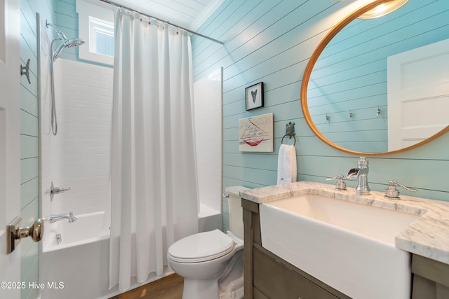 1044 Ocean Blvd W, Supply, NC 28462 - full bathroom with vanity, shower / bathtub combination with curtain, toilet, wooden walls, and wood finished floors